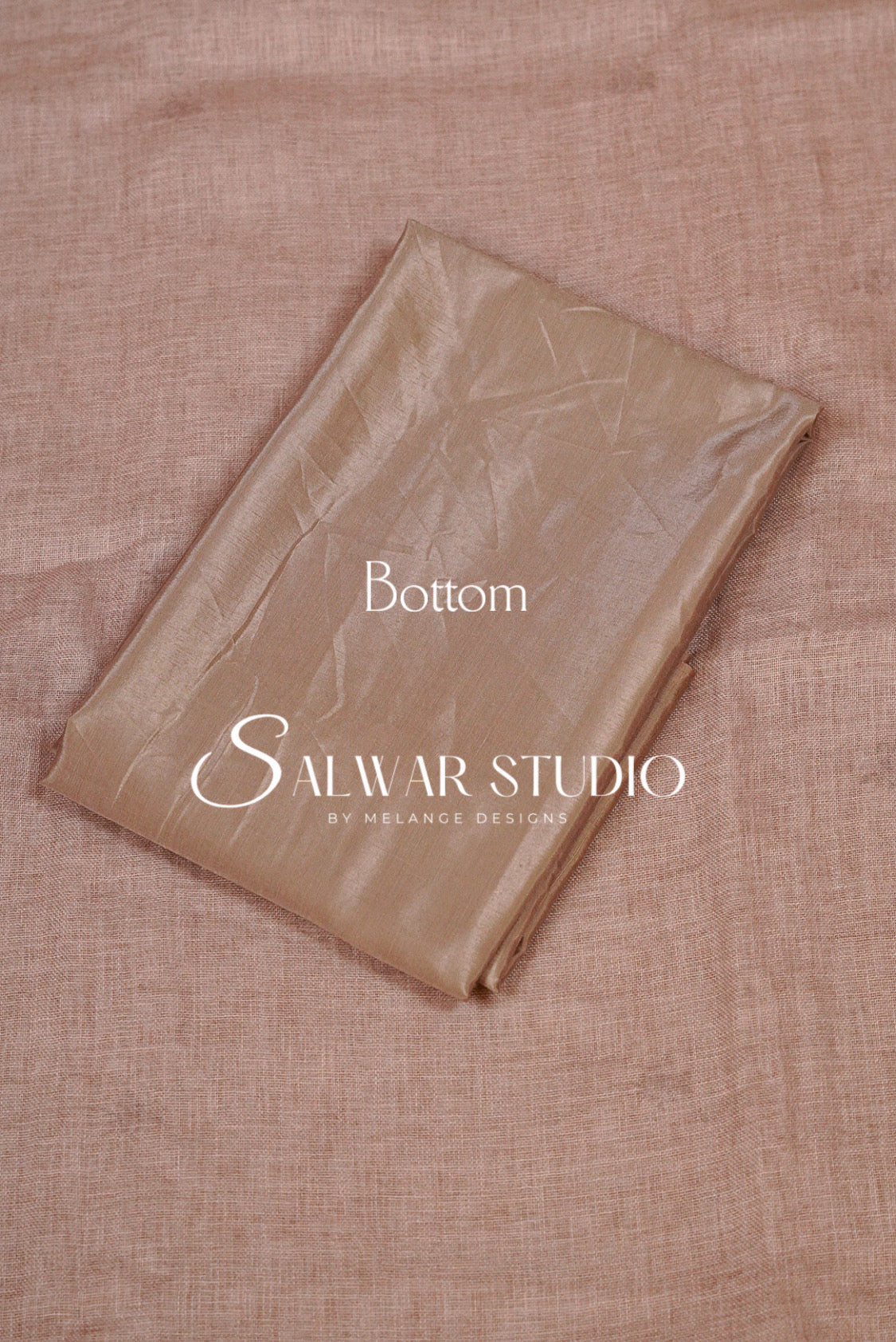 A folded piece of shimmering champagne-gold fabric, labeled Bottom.