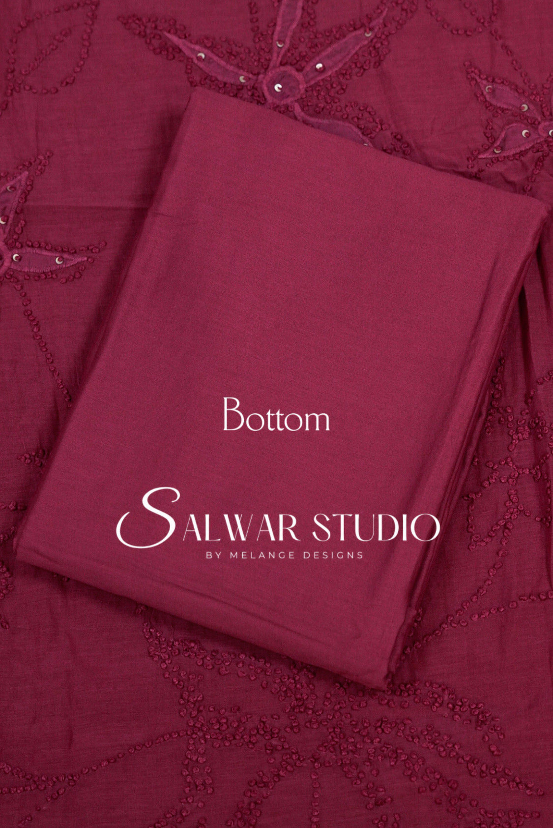 A folded maroon bottom fabric piece with embroidered floral details, labeled 'Bottom' and 'Salwar .