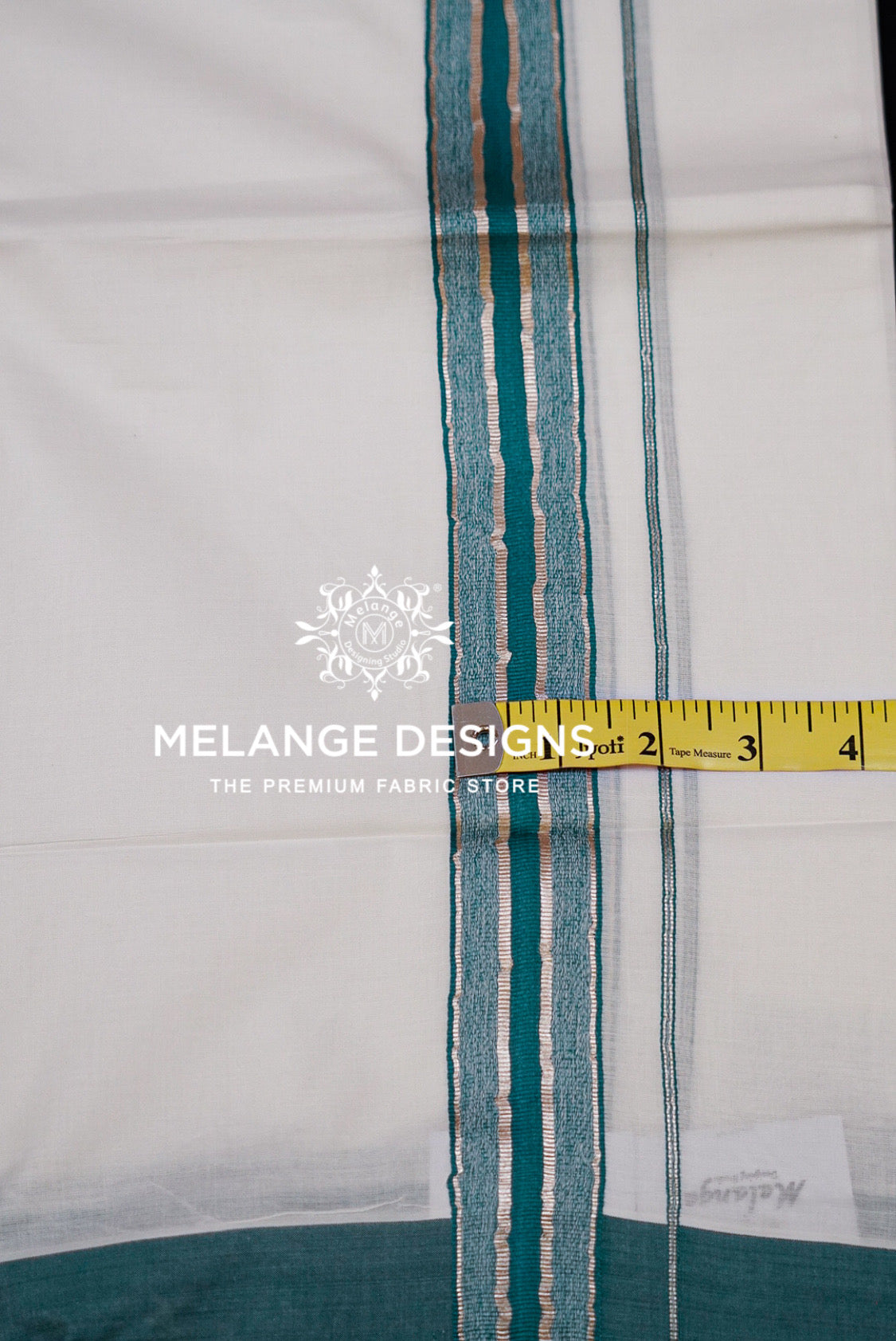 Premium Cotton Dhoti for Men White with Teal Green Close Up.