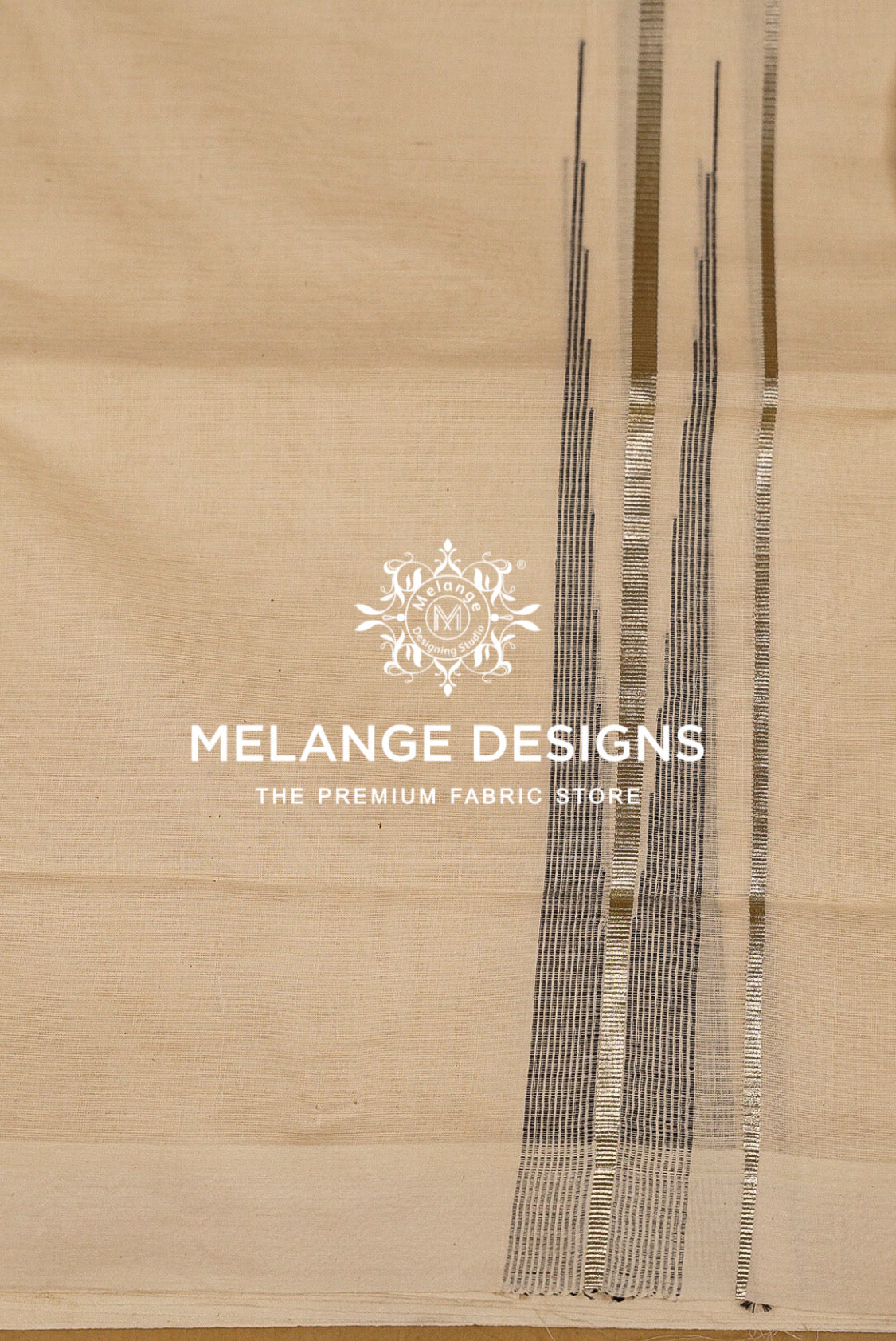 A close-up of a beige fabric sample with vertical metallic silver and gold stripes.