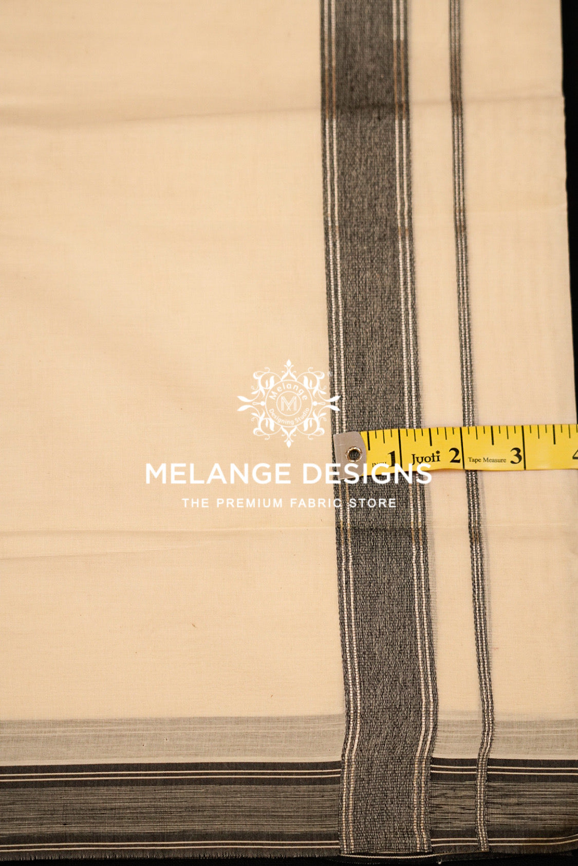 Premium Cotton Dhoti For Men Cream with Charcoal Grey Stripe Border Close Up.