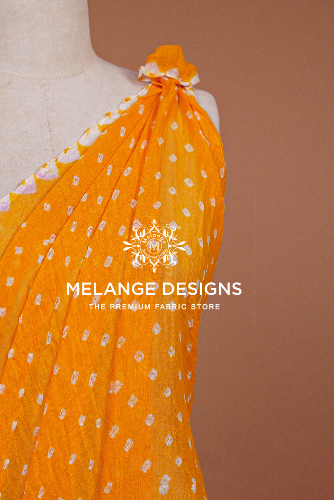 A bright orange fabric draped .