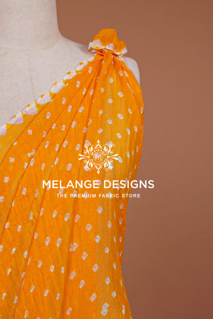 A bright orange fabric draped .