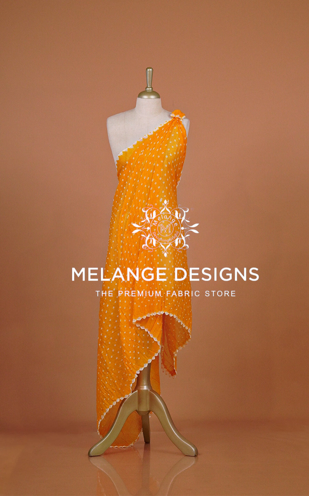 An orange one-shoulder dress with white polka dots .