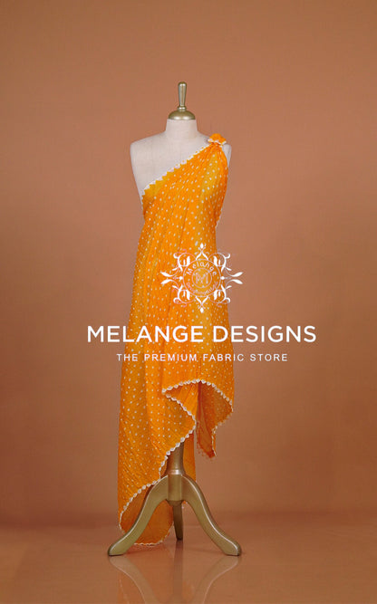 An orange one-shoulder dress with white polka dots .