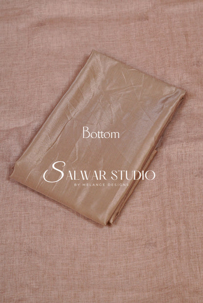 A folded piece of shimmering champagne-gold fabric, labeled Bottom.