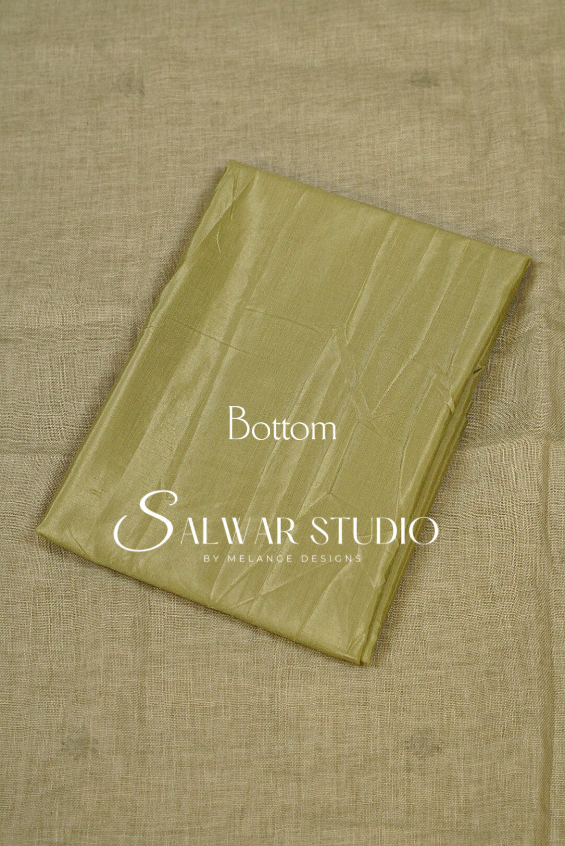A folded olive green fabric piece Bottom.