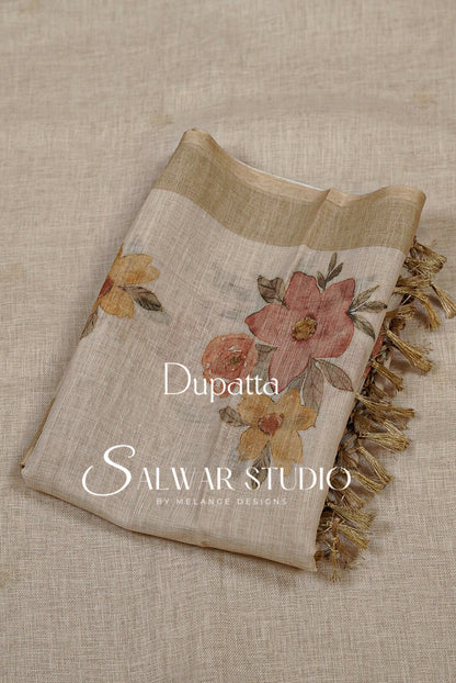 A folded dupatta with a beige linen-like base, featuring a large dusty pink and orange floral print, yellow flowers, and gold fringe.