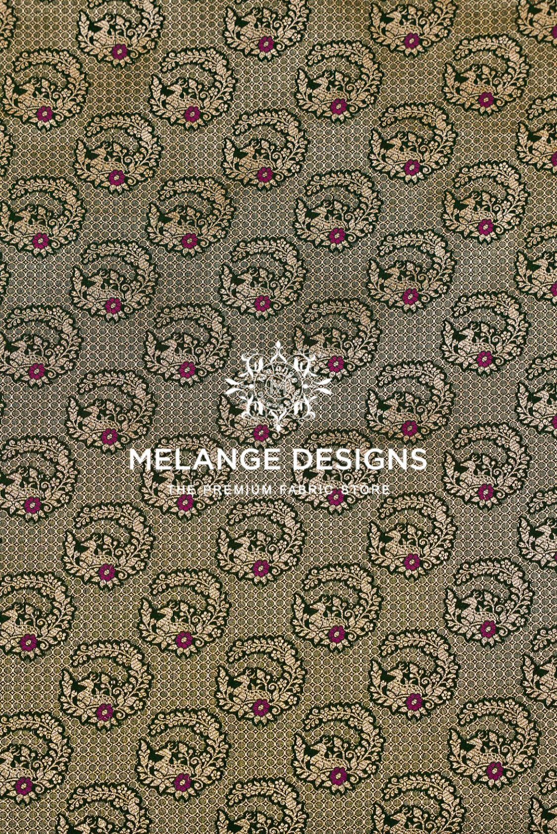A close-up of a Banarasi Silk Brocade Banarasi Silk Brocade Fabric pattern featuring a repeating circular floral and paisley motif in olive green, beige, and magenta.