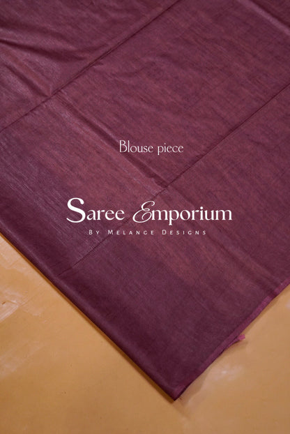 A close-up of a deep plum purple fabric.