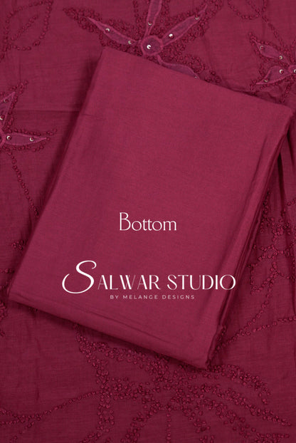 A folded maroon bottom fabric piece with embroidered floral details, labeled 'Bottom' and 'Salwar .