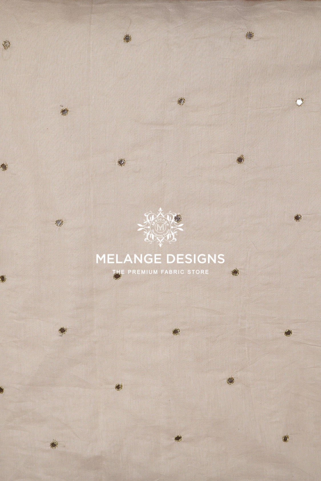 Beige Chanderi Glass Work Fabric Dyeable  with scattered small metallic gold and silver embellishments.