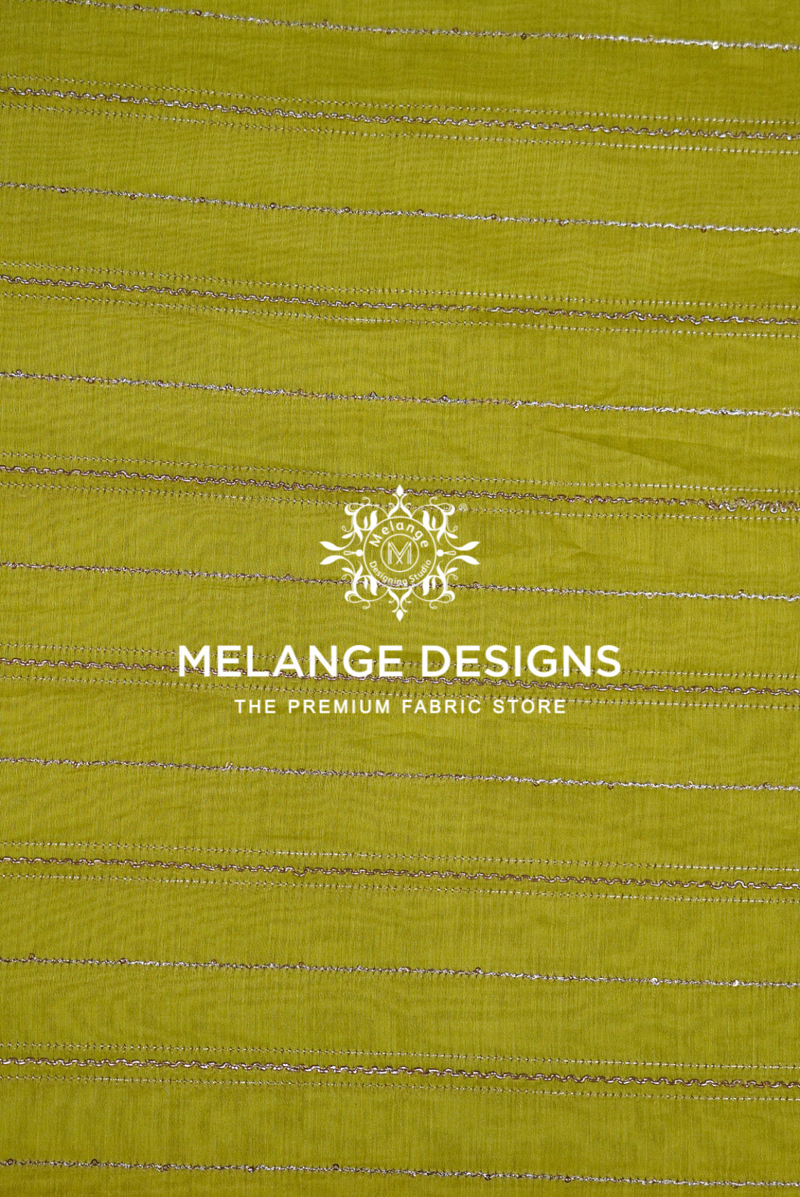 A close-up of a Chanderi Silk Embroidery Fabric sample in a muted olive yellow-green color, featuring horizontal metallic silver stripes.