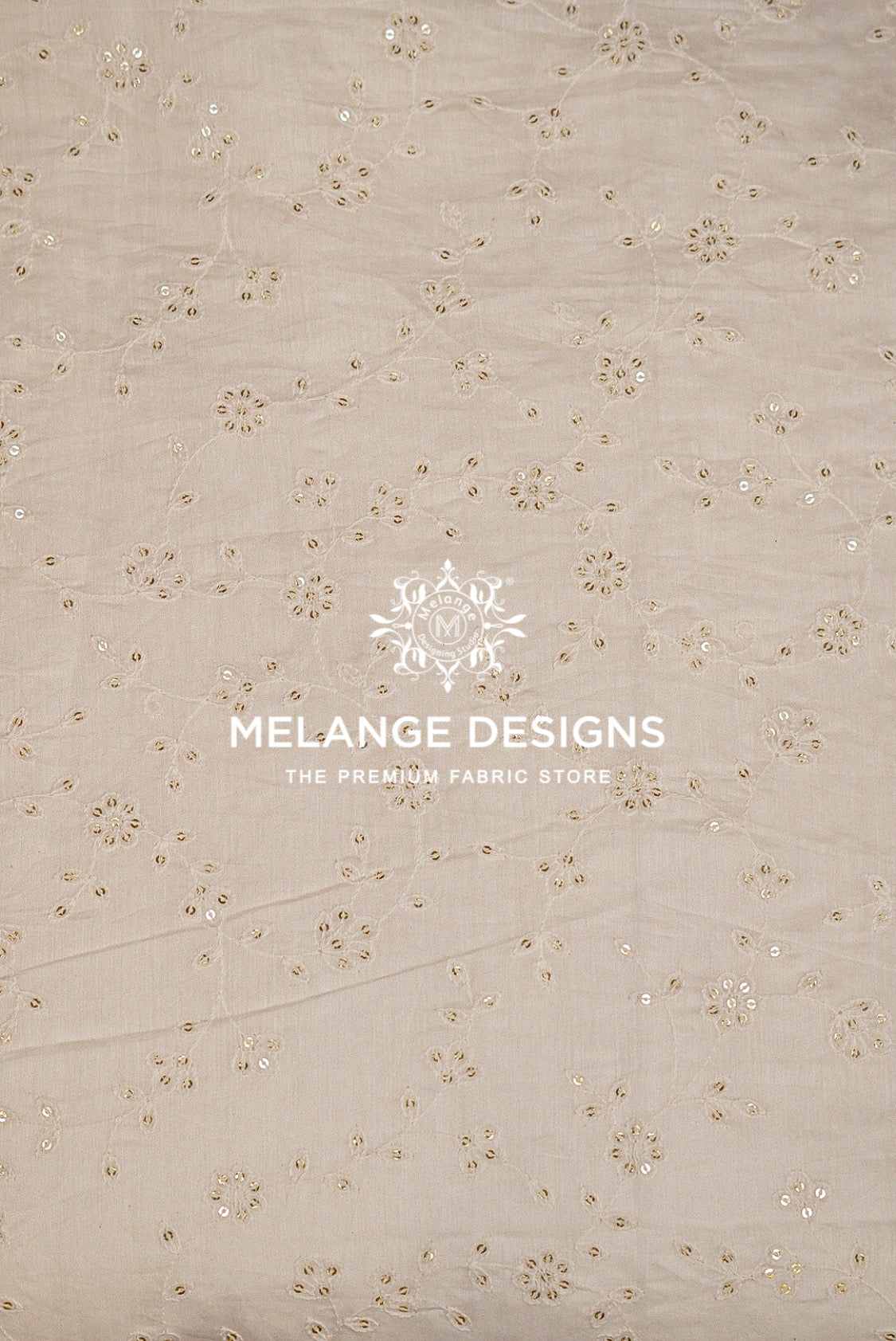 Beige cotton Chanderi Silk Embroidery Fabric with delicate floral eyelet embroidery and sequin embellishments.