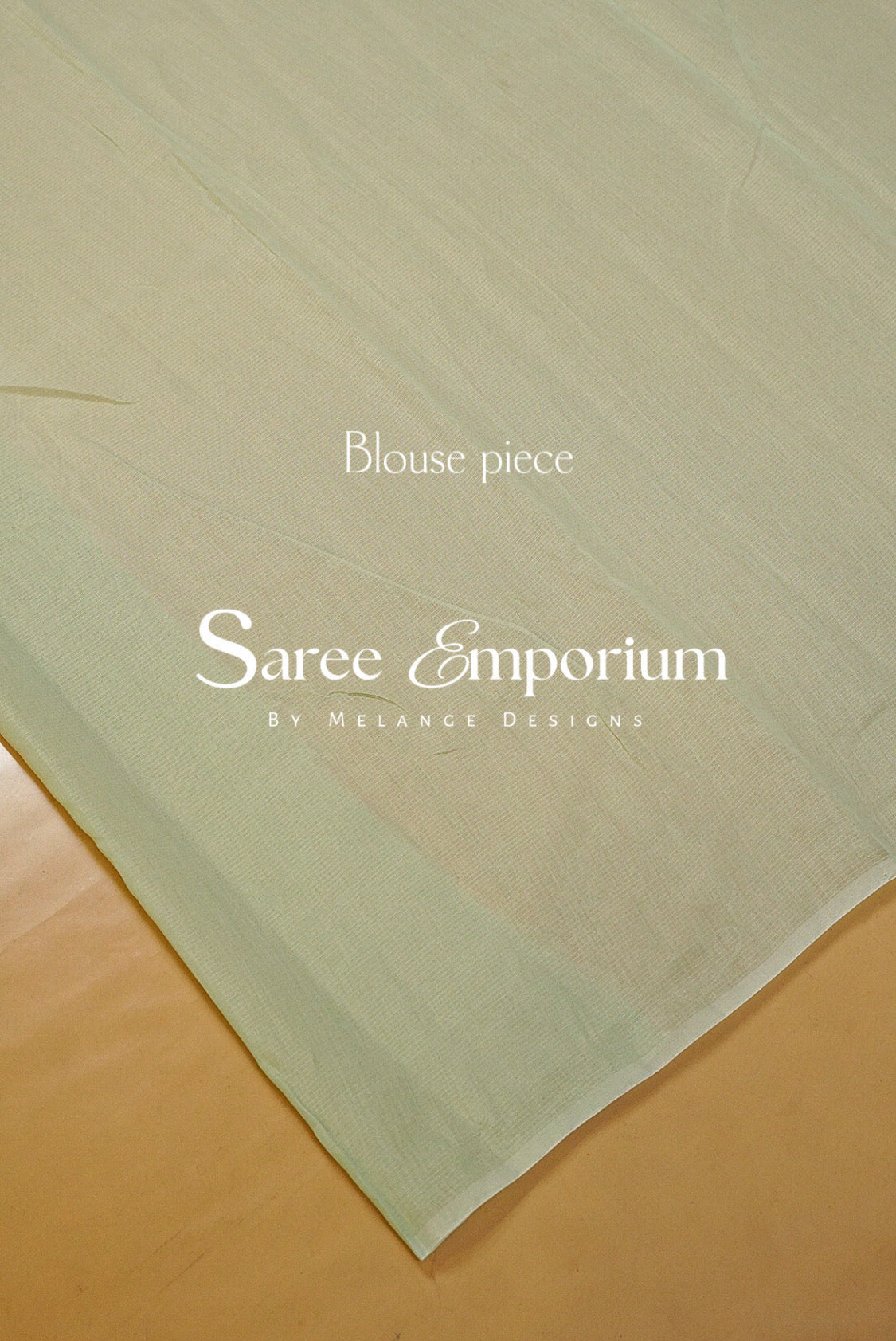 A delicate Kota Embroidery Saree in a refreshing pastel mint-green shade, beautifully detailed with intricate floral embroidery throughout. The sheer, lightweight texture gives it an airy and graceful drape, while the scalloped embroidered border adds a refined feminine finish.