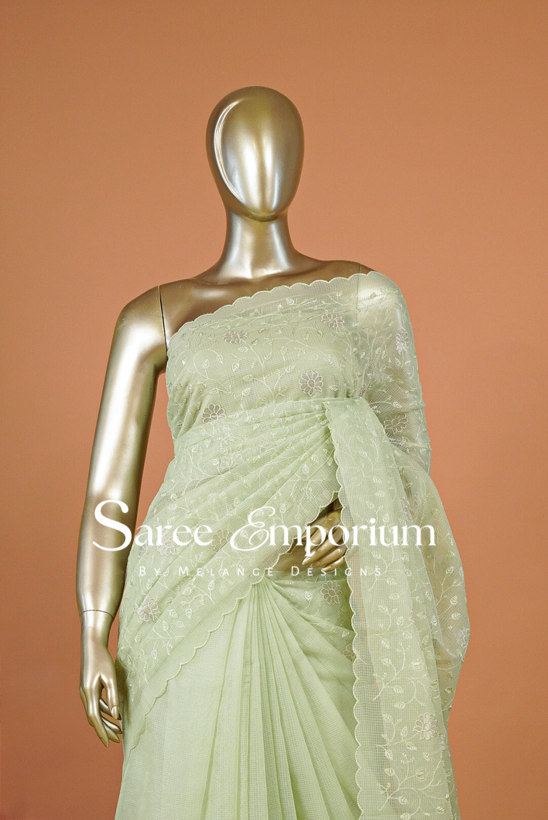 A pale mint green embroidered saree 