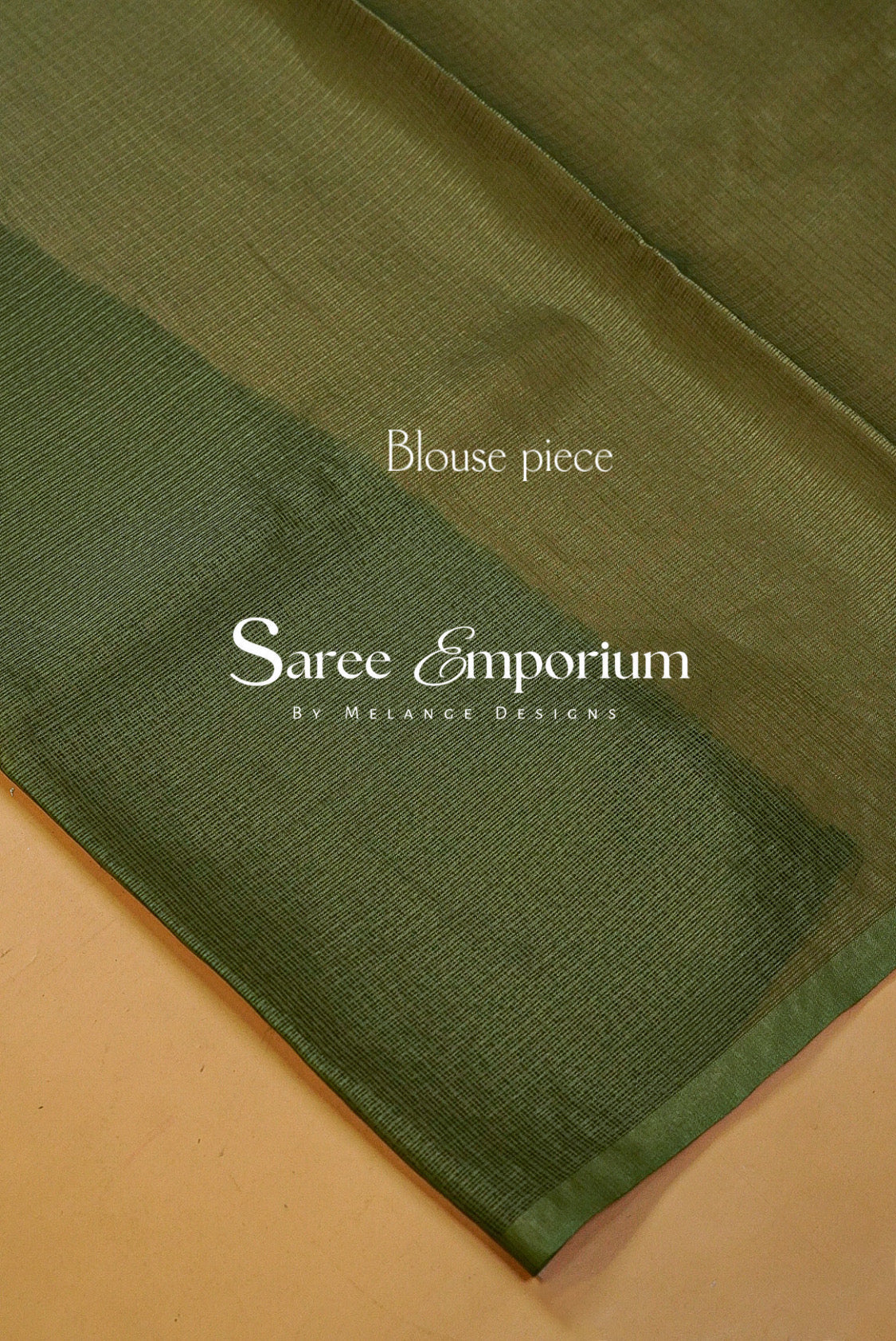 An olive green sheer blouse piece fabric .