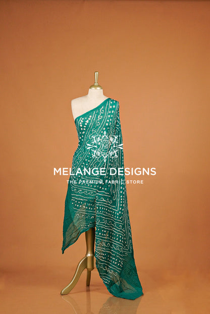 A teal green saree with white 