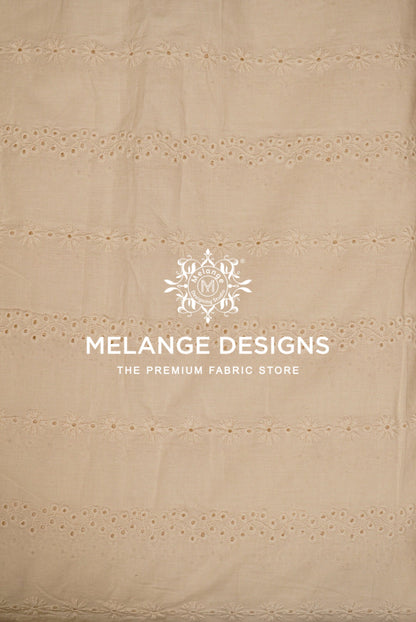 Beige cotton Cotton Hacoba Fabric Dyeable with horizontal eyelet embroidery .