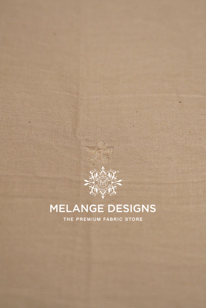 A close-up of a beige Cotton Plazzo Fabric Dyeable .