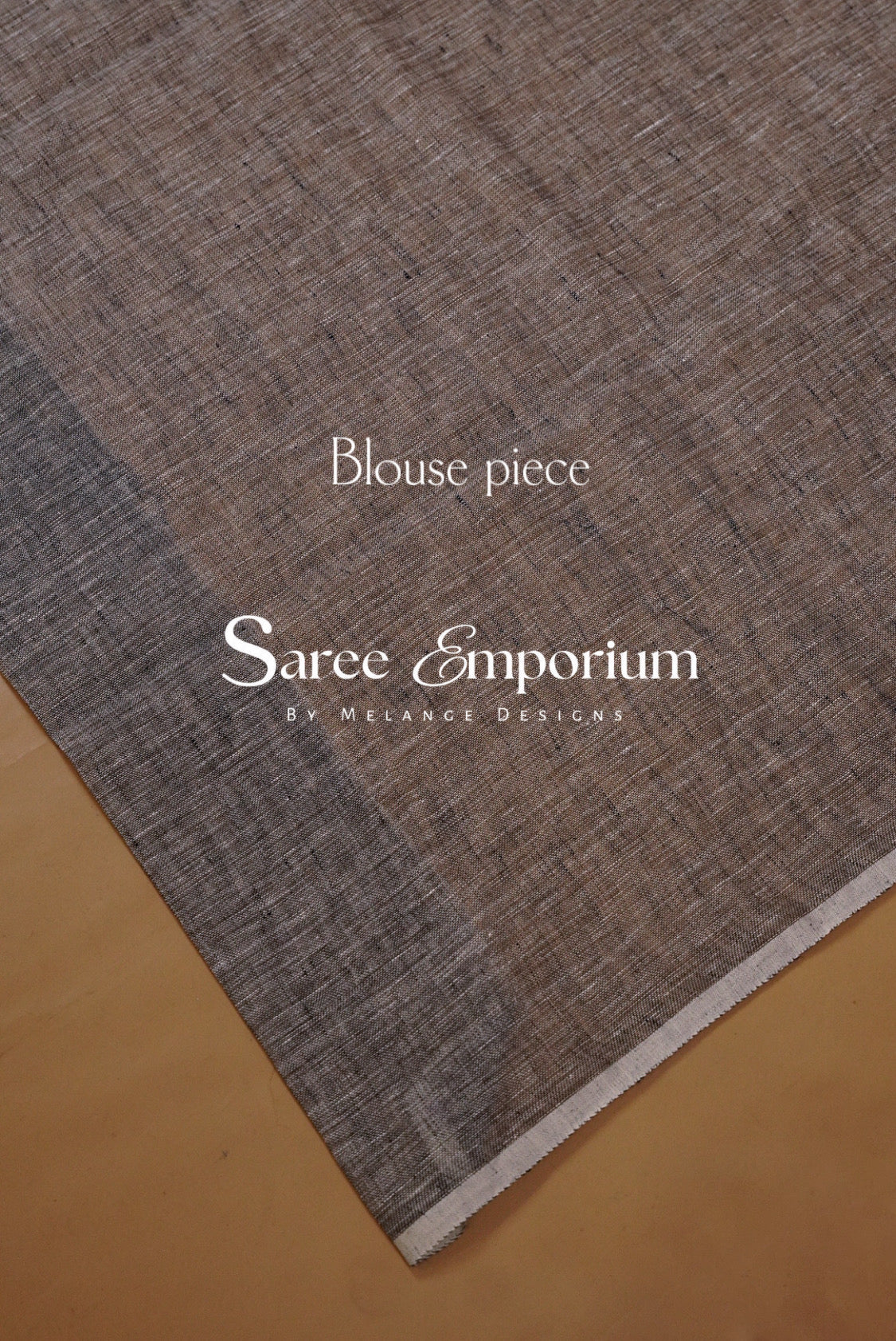 A close-up of a textured fabric swatch in a heathered taupe-brown color.