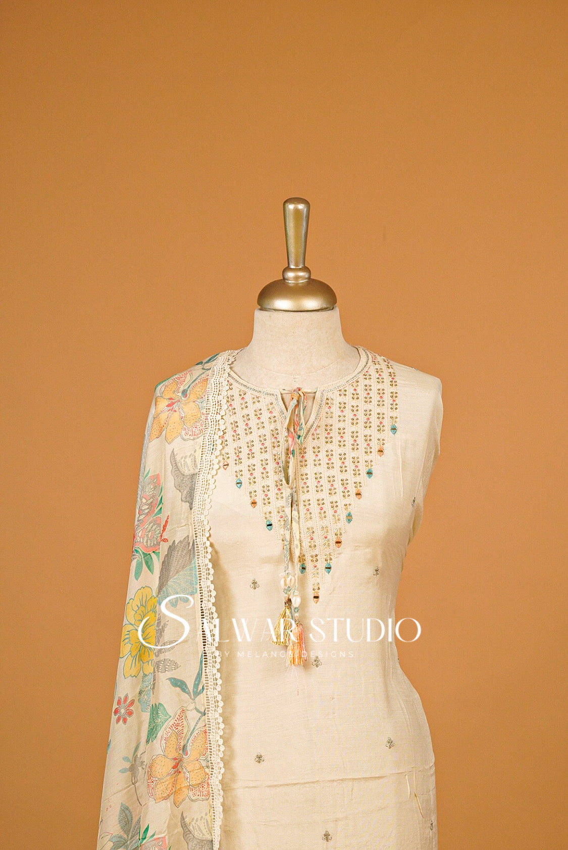 Muslin Embroidery Semi Stitched Salwar Suit Ivory Cream Material Close View.