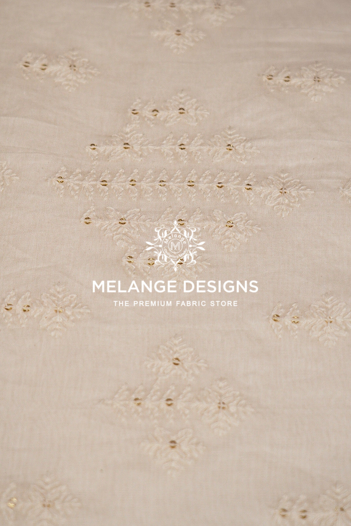 Beige Premium Cora Cotton Fabric Dyeable  with delicate embroidered floral patterns and small gold bead accents.