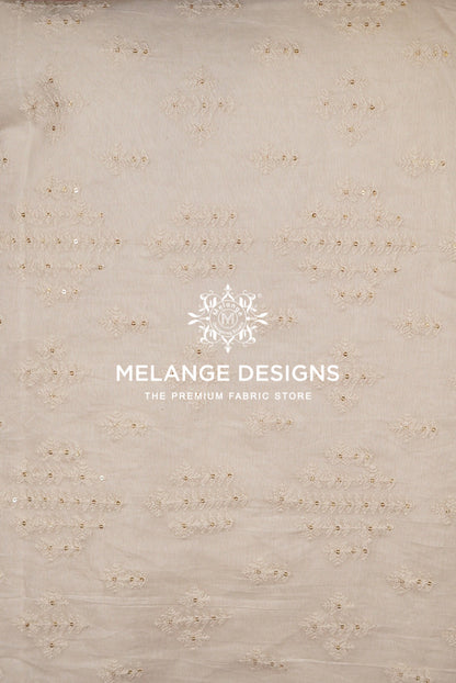 Beige Premium Cora Cotton Fabric Dyeable  with delicate gold sequin and embroidery patterns.