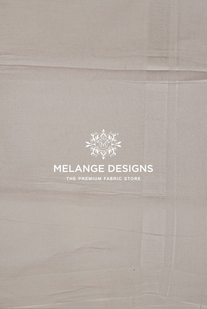 A close-up of a light beige fabric .