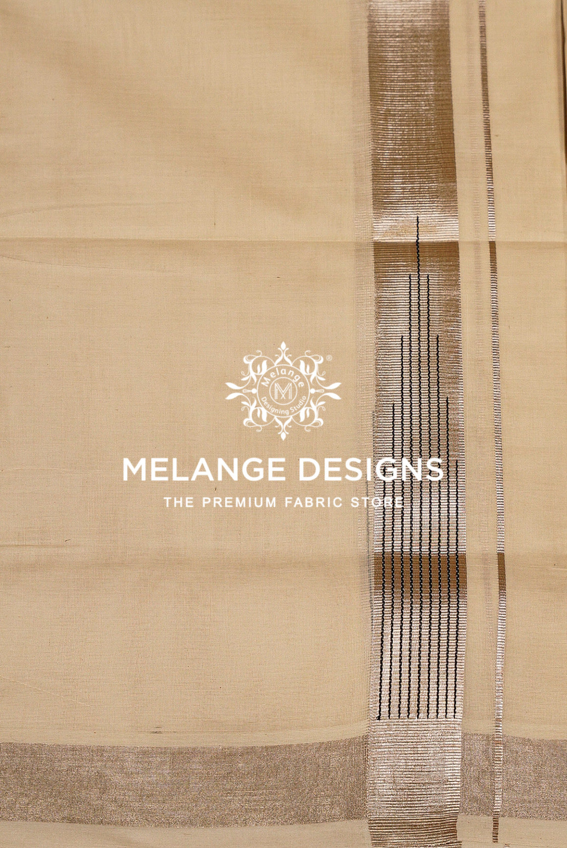 A close-up of a beige fabric with a vertical metallic gold and silver patterned stripe .