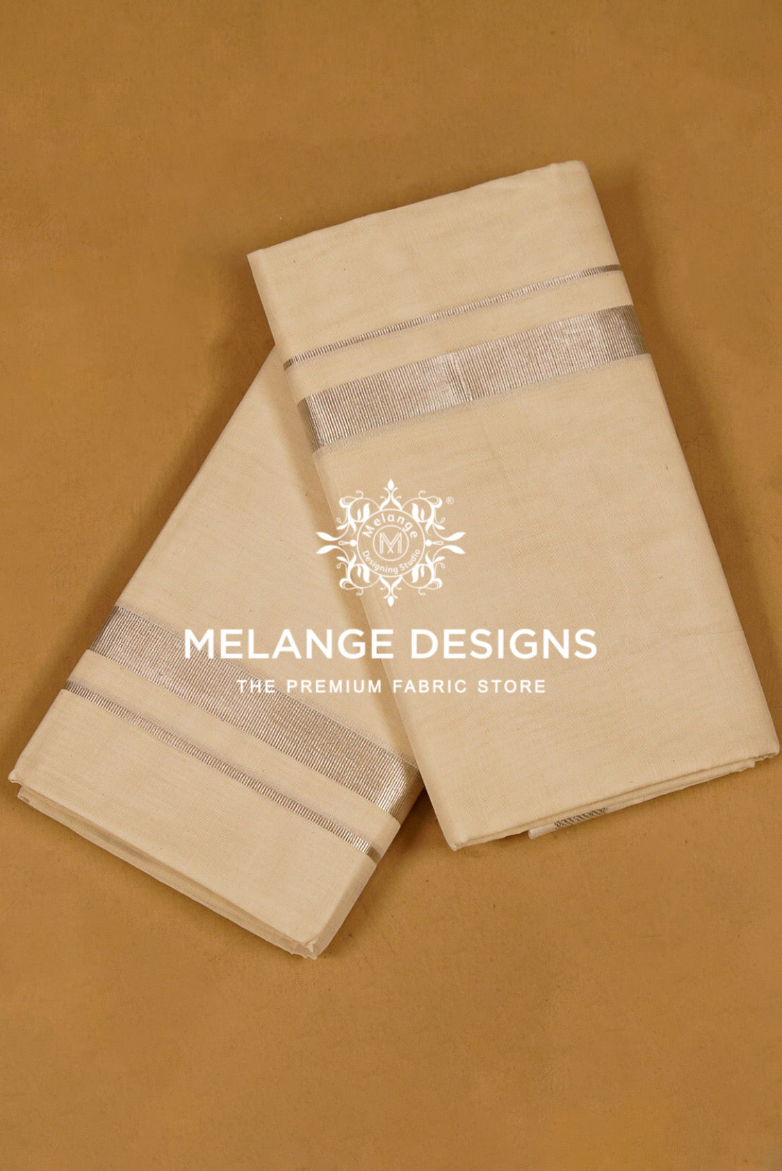 Two folded cream-colored fabric pieces with a metallic silver band near the top