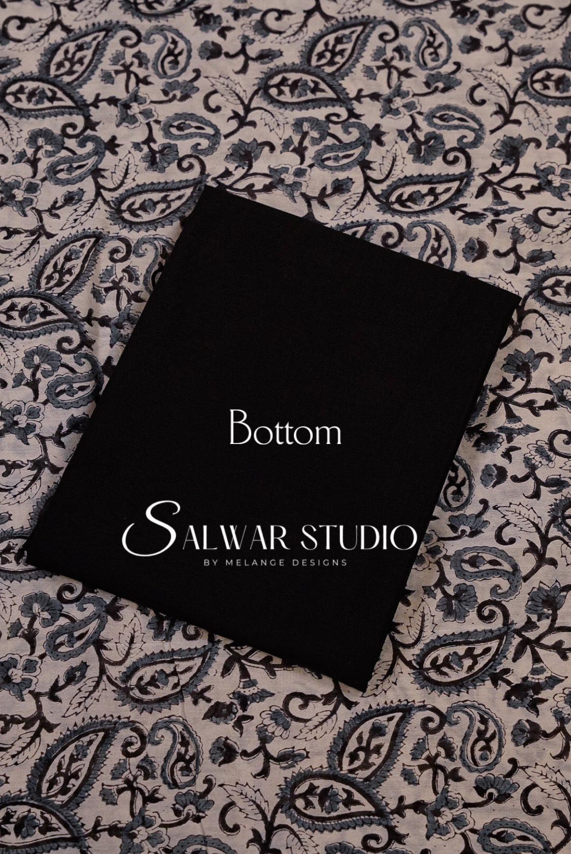 A black fabric bottom panel with white printed text reading Bottom.