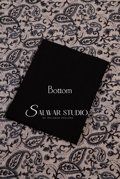 A black fabric bottom panel with white printed text reading Bottom.