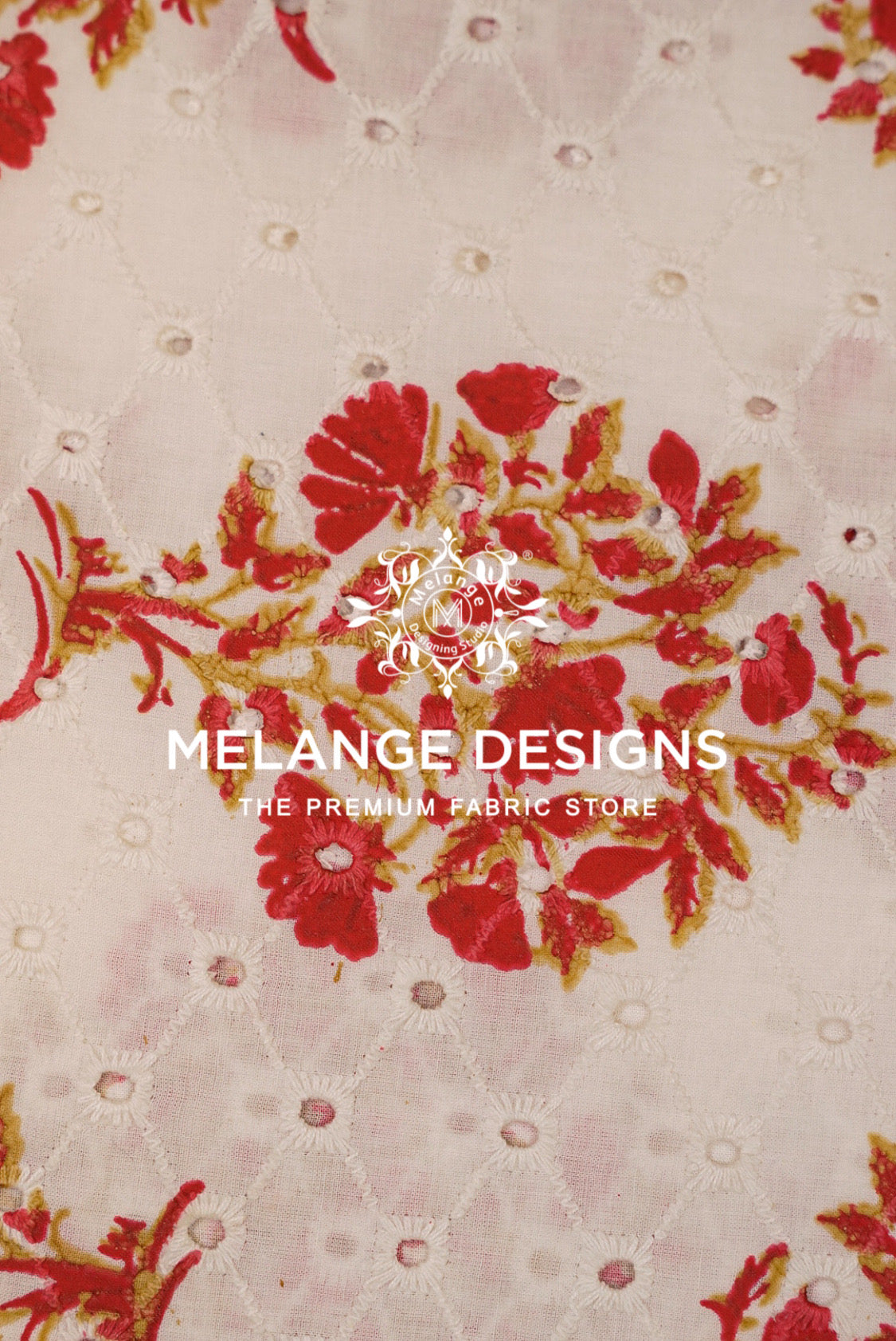 A close-up of a Printed Cotton Hacoba Fabric pattern featuring red floral motifs with gold outlines on a light beige background with a subtle diamond quilted texture. 