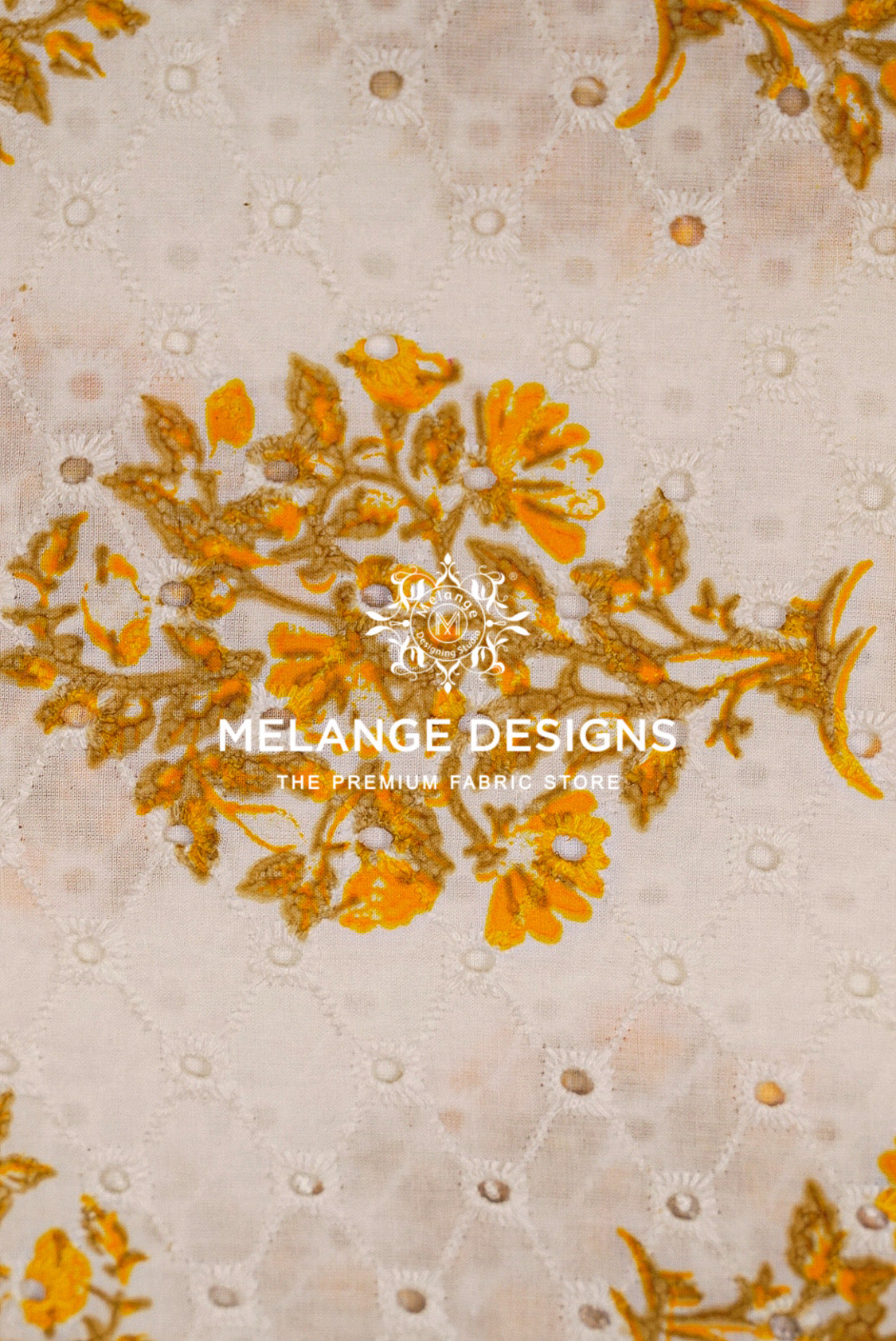 A close-up of a Printed Cotton Hacoba Fabric sample featuring a beige base with a quilted diamond pattern and a central gold floral embroidery motif. 