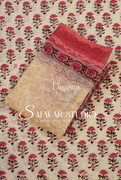 A folded dupatta fabric sample from Safwar Studio, featuring a beige base with a red and green floral block print and a red border.