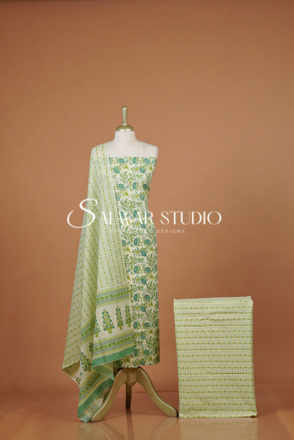 A light green and white printed salwar suit set  featuring a printed kurta, draped dupatta.