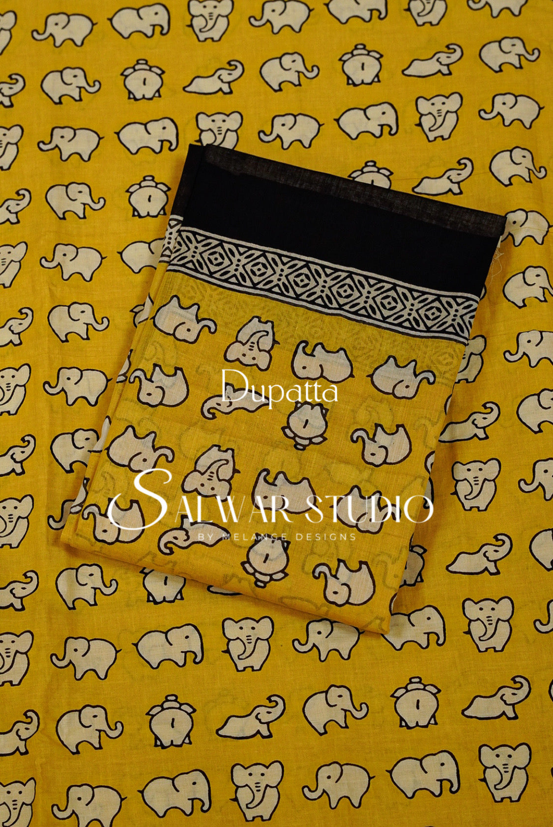 Yellow dupatta fabric with a repeating elephant print and a black border featuring a white geometric pattern.