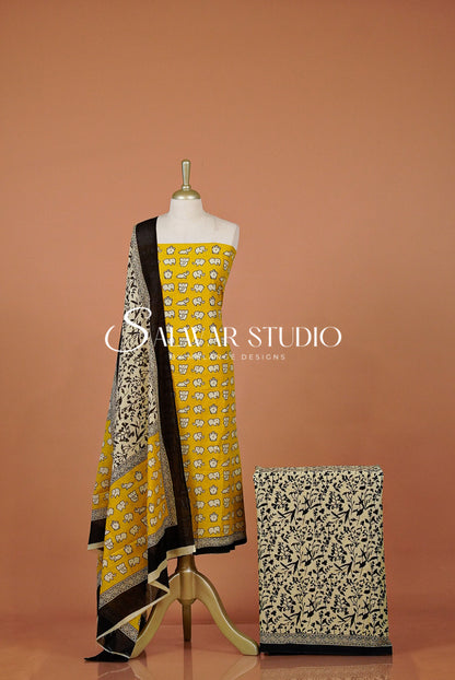 A yellow and black printed salwar suit .