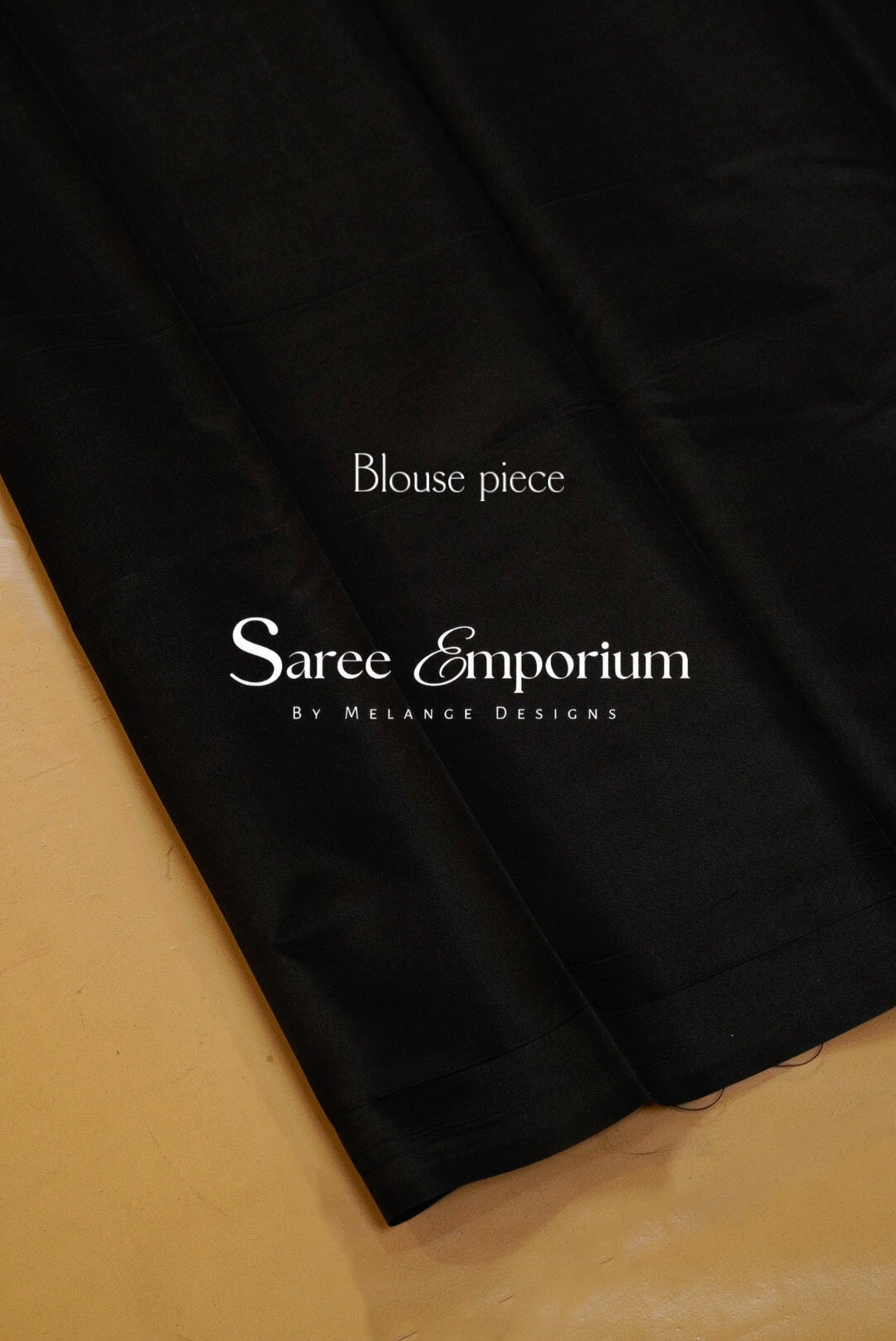 A close-up of a black blouse fabric garment .