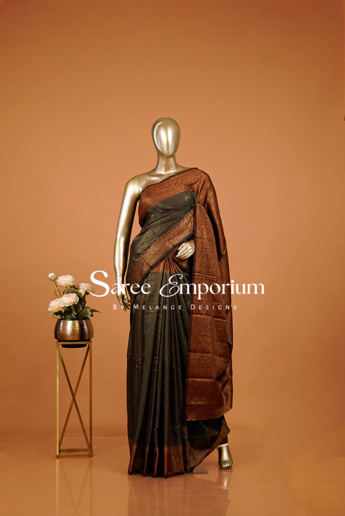 rust and black saree with a antique-gold .