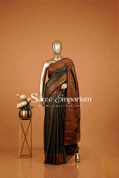 rust and black saree with a antique-gold .