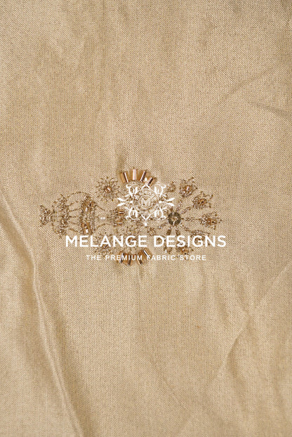 Beige linen Tissue Satin Embroidery Fabric Dyeable with a central embroidered floral design in gold and white, featuring .