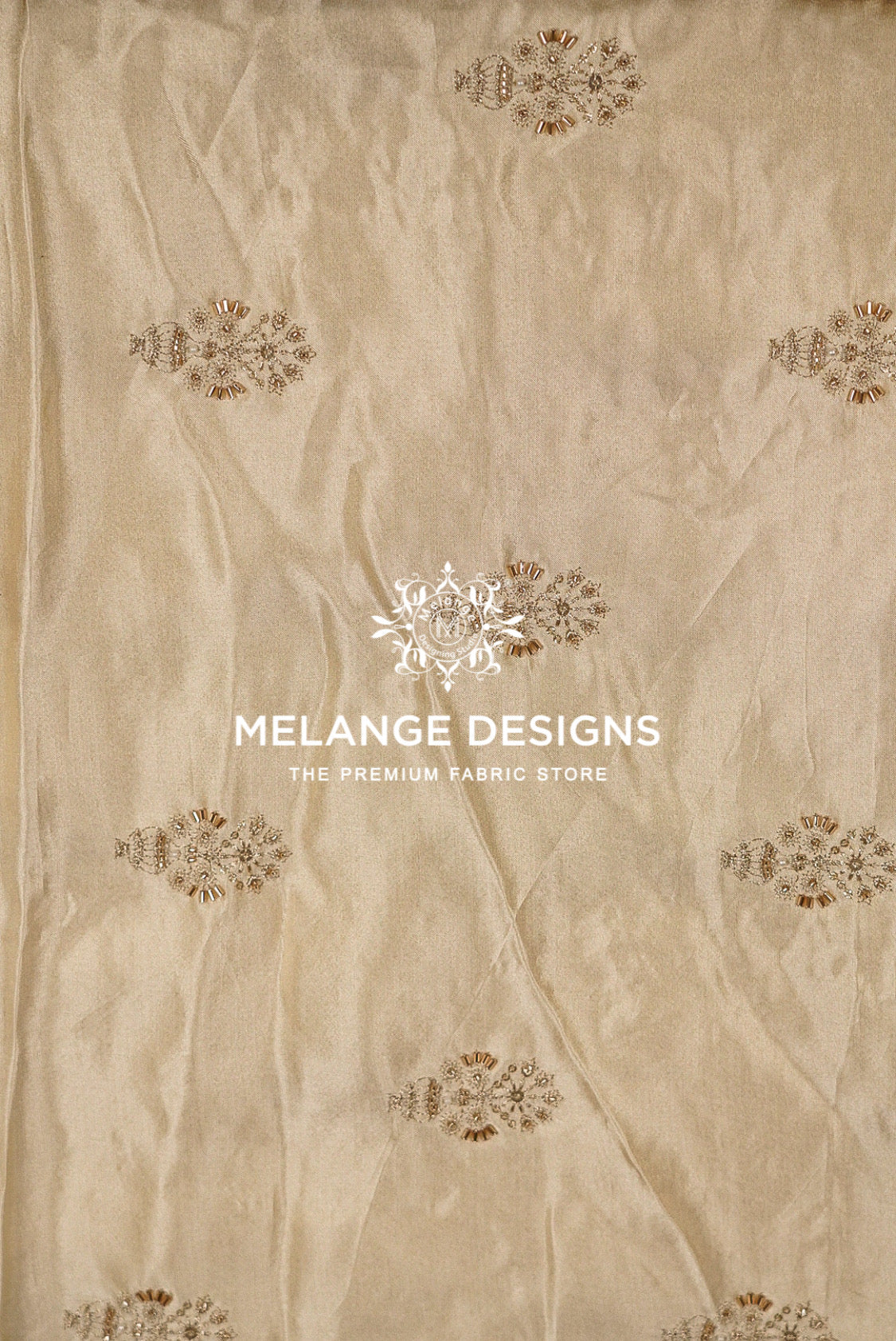Beige silk-like Tissue Satin Embroidery Fabric Dyeable  with a subtle sheen and scattered brown floral motifs.