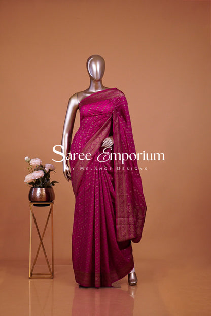  deep magenta-fuchsia saree with subtle gold motifs.