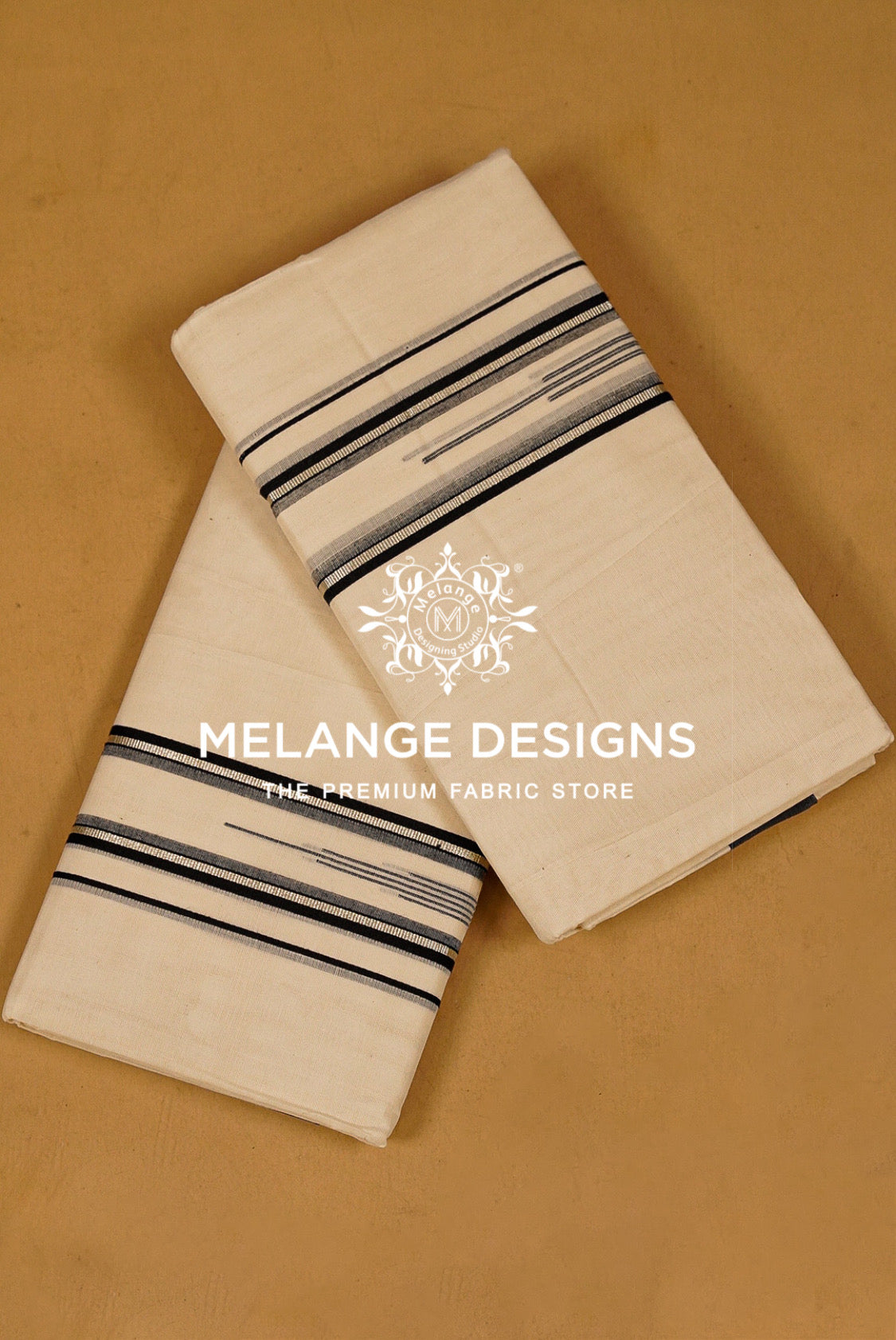 Two folded cream-colored cotton fabrics with black and gray striped borders.