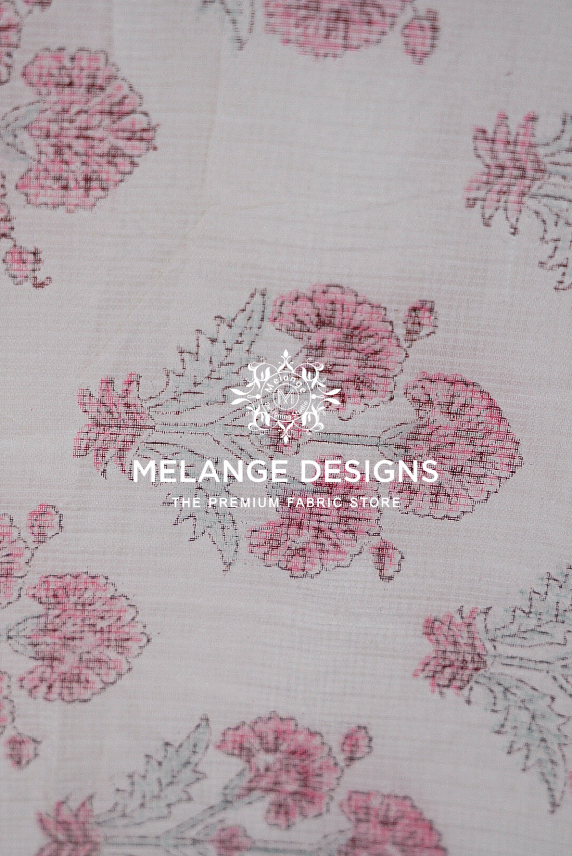 A close-up of a Printed Cotton Cotta Fabric  pattern featuring pink and dusty rose floral motifs on a light beige .