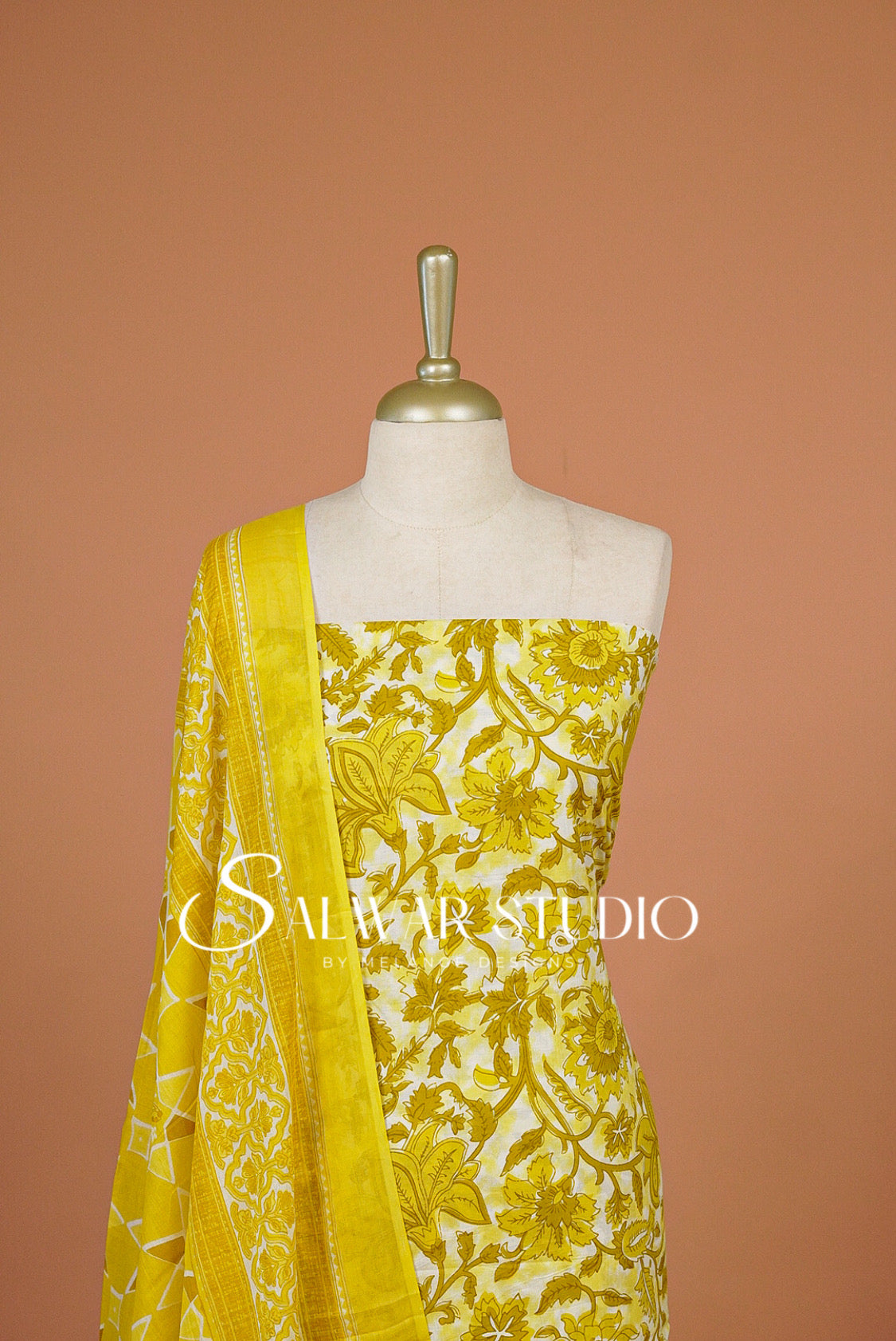 A yellow and white floral printed fabric set .