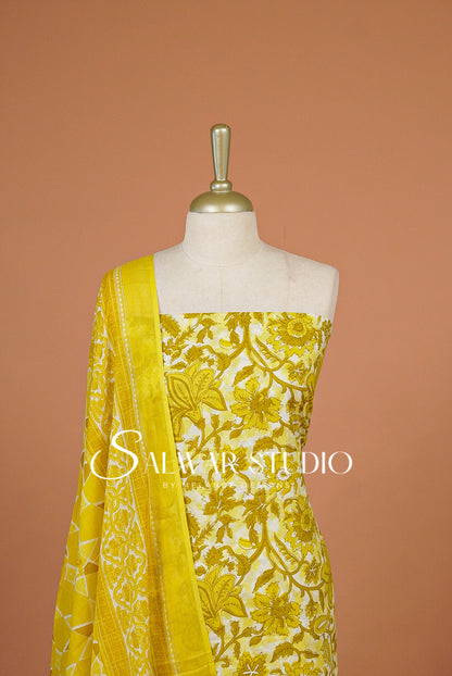 A yellow and white floral printed fabric set .