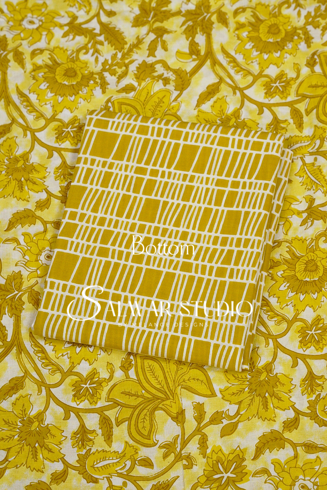 A folded fabric sample with a yellow and white grid pattern.